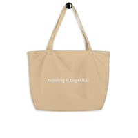 holding it together. Tote Bag